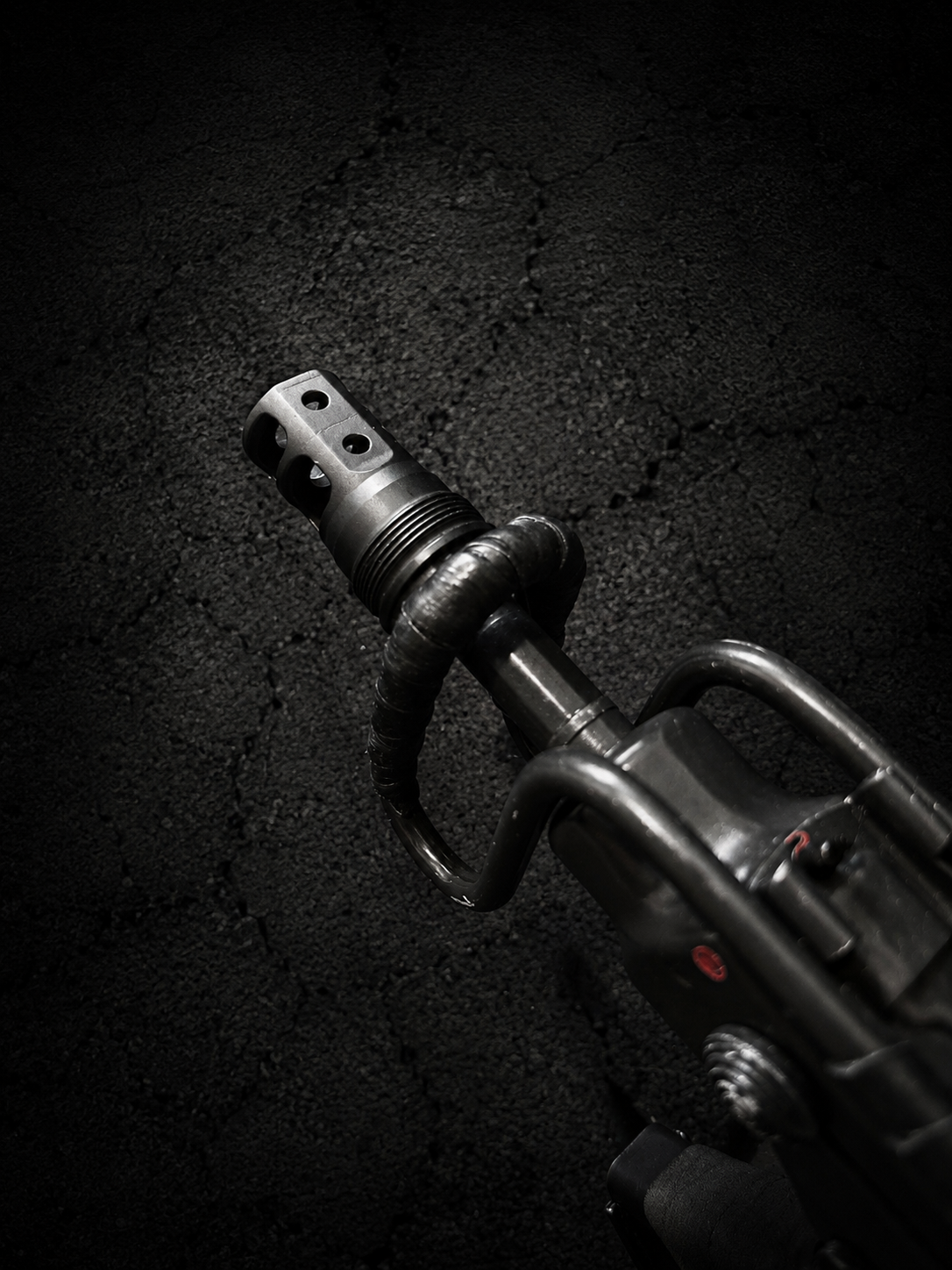 PsychWard Labs Hammer compact 1/2x28 muzzle brake and Plan B-compatible suppressor mount installed on a firearm barrel.