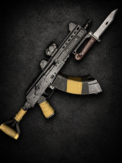 PsychWard Labs Harpoon M-LOK bayonet adapter mounted on an AK-pattern rifle with an AK bayonet.